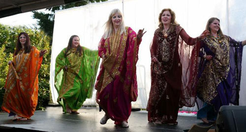 Five dancers in long dresses